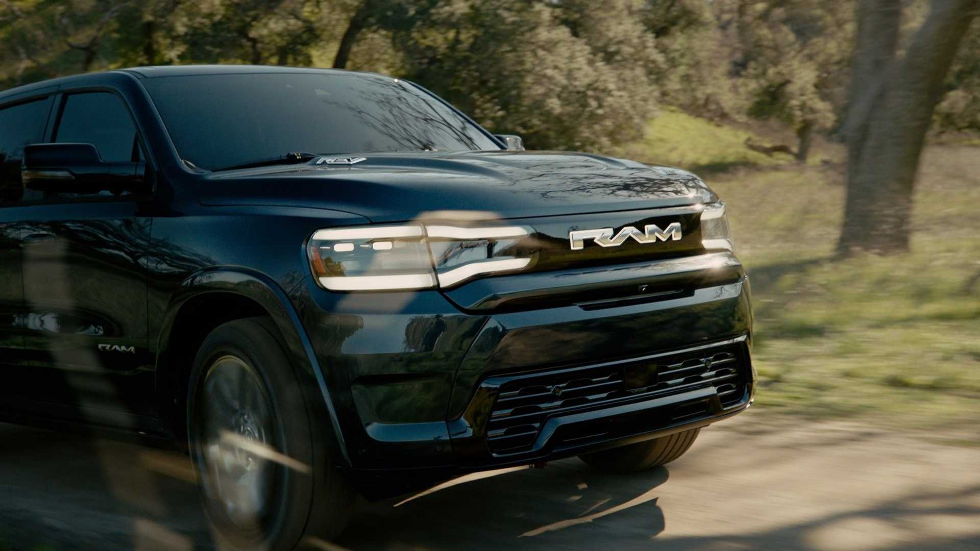 2024 Ram 1500 REV exterior front three-quarter view driving
