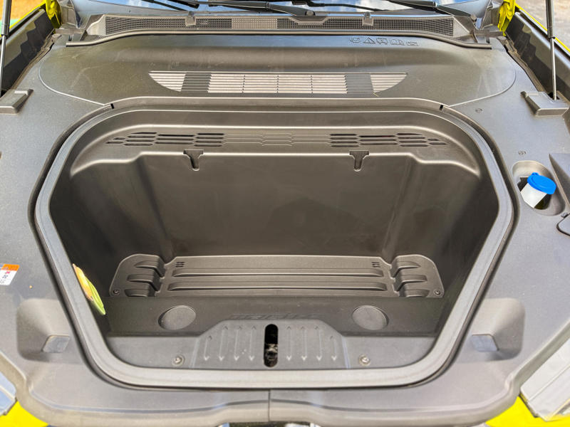 The rear cargo compartment is supplemented by a 4.7 cubic foot frunk under the hood.
