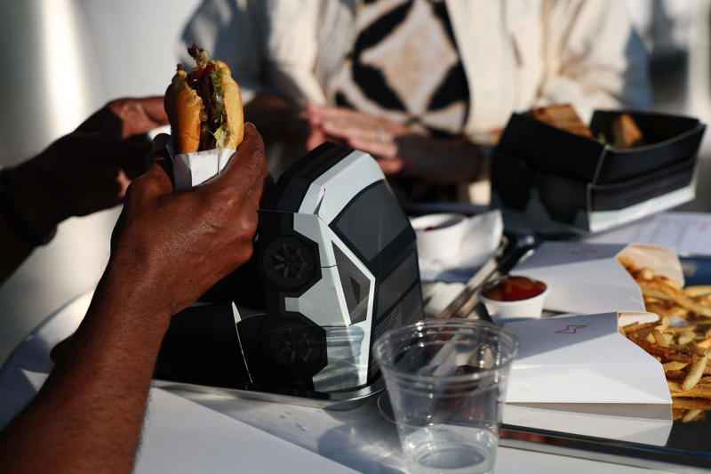 The menu includes classic American diner fare, like a burger and fries, with a twist.