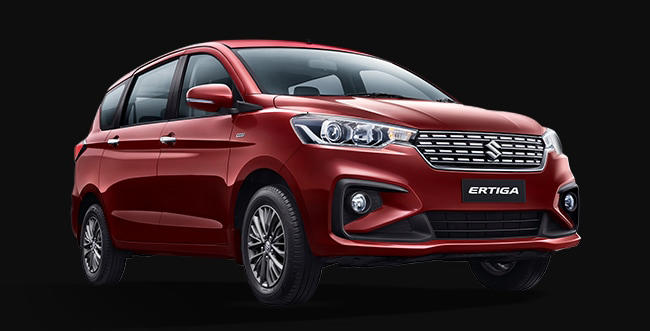 Maruti Ertiga Space: The Maruti Ertiga is priced between ₹9.12 lakh and ₹13.41 lakh with a 103hp, 1.5-litre petrol engine. It has wide-opening doors and broad, cushioned front seats. The second row slides and reclines for added legroom. Middle-row seats do not tumble, making last-row entry harder. The last row offers good headroom, shoulder room, vents, and Type-C charging ports.